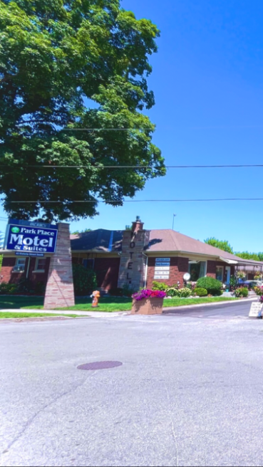 A picture of the Park Place Motel in Tweed. The image shows a blue sign and a brick motel.