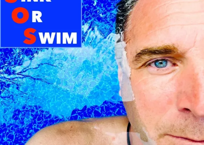 Close up of half a person's face while he's floating in pool, blue water, name of event